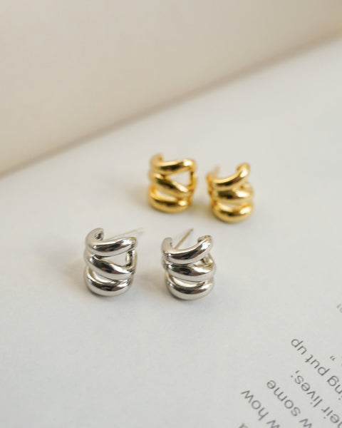 pull off the cool-girl multiple piercings trend with thehexad's new triple illusion earrings in gold and silver