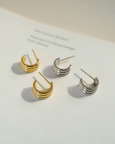 shop small hoop earrings in gold and silver steel from online jewelry brand the hexad