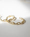 Modern golden hoop earrings for women designed by The Hexad