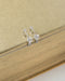 close up of elegant diamante design details in new arrival pixie huggie hoop earrings in silver