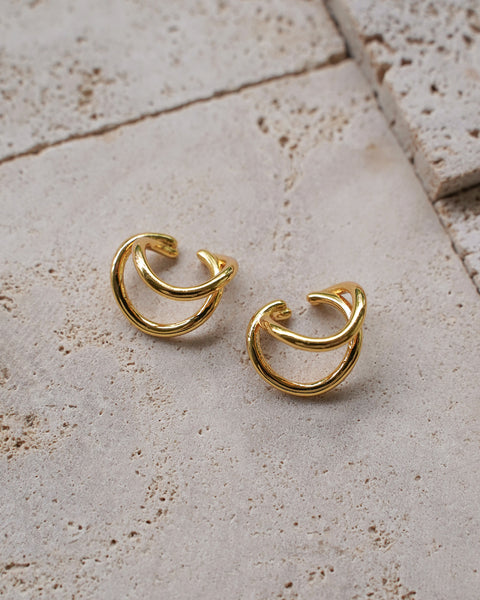 minimalist wave-like ear cuffs in gold by the hexad