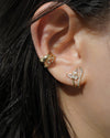 stunning ear stack combo featuring corsage illusion earring, iconic cosmic and cult ear cuffs by the hexad