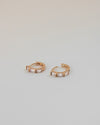 stylish hoop earrings with oblong cut diamonds designed for a snug fit by the hexad