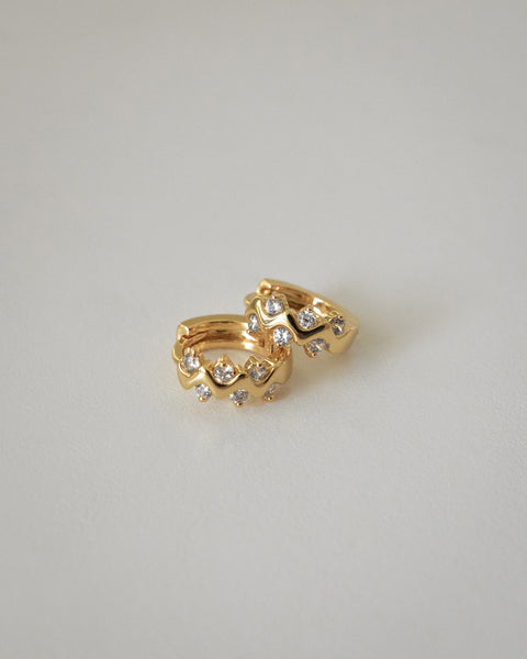 wavy design hoop earrings with diamonds by the hexad