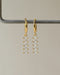 aurora dangle huggie hoop earrings in gold is your next party jewelry must have