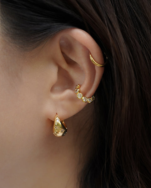 clicker style solaris teardrop hoop earrings are both perfect when worn on its own and when layered with cuffs for a stacked look