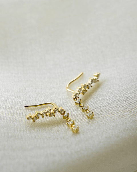 close up of the hexad comet climber earrings designed with a myriad of brilliant zirconia stones