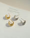 contemporary open hoop earrings with straight ear posts in gold and silver perfect for both day and night