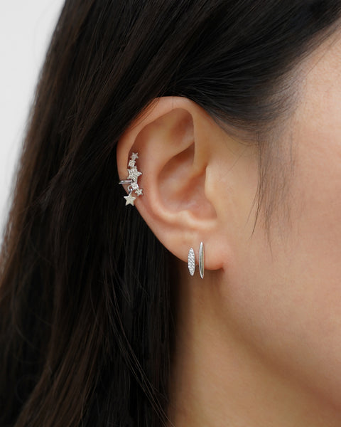 create the ear stack of your dreams with the hexad's newest auriga ear cuffs and revelry illusion earrings in silver