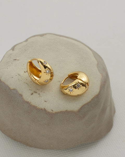 delightful sunburst motifs are the highlight of the hexad solaris teardop hoops