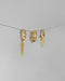 elevate your holiday ear stack with the spike ear party set of three huggie hoop earrings in gold