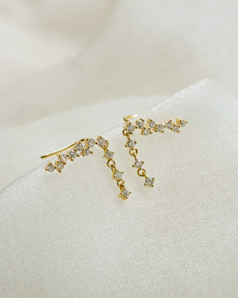 gather up your hair and let your ears sparkle with this stunning pair of comet climber earrings in gold