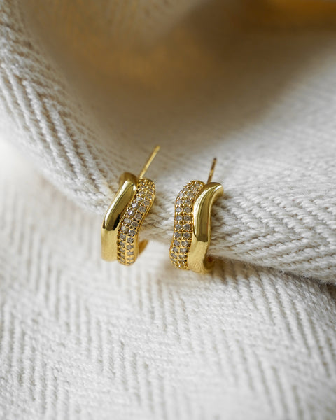 intricate close up details of crest double hoops earrings pave with glistening diamond stones for sophisticated style