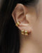 layer on the hexad's latest cleopatra hoops with its popular cleopatra ear cuffs in gold for a bold looking ear stack