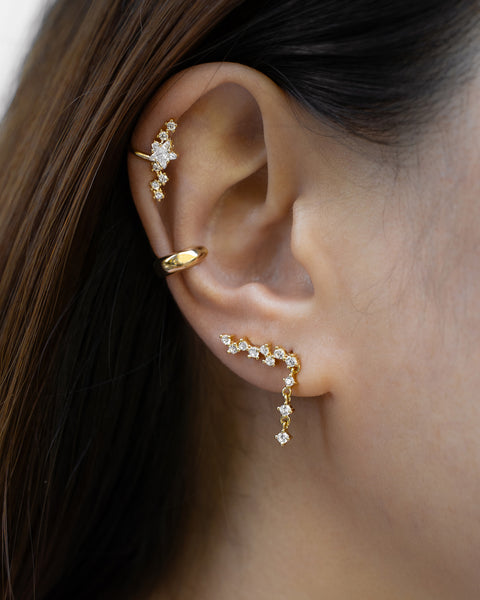 make an impactful and gorgeous ear stack with the hexad comet climber earrings, iconic constellation ear cuff and signature cult ear cuff