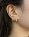 many ways to wear the multiple stacked look with tiny huggie earrings and tiny stud earrings