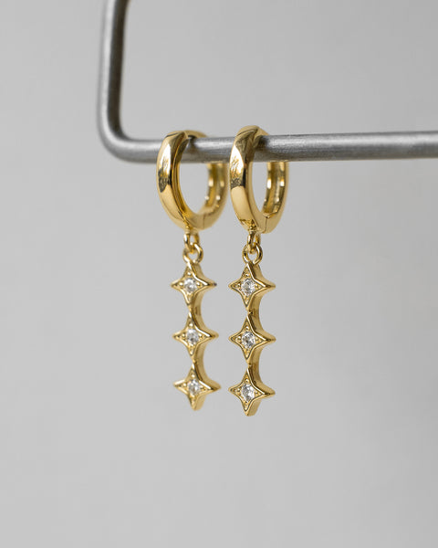 nova dangly earrings feature trio of starry diamond stones for a dreamy romantic vibe