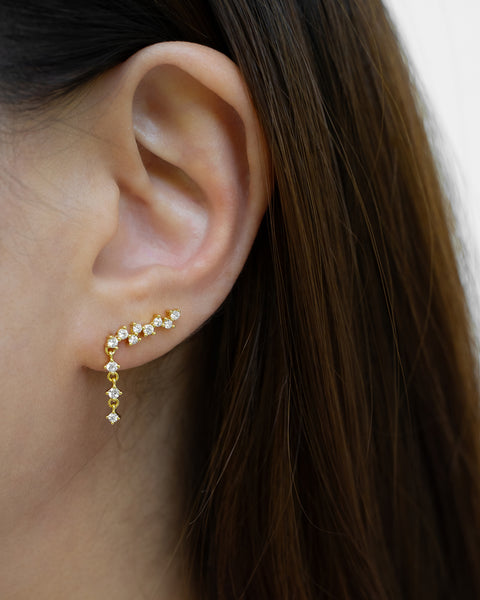 only one ear piercing needed to wear this comet climber earring that drapes up along the ear and cascades down elegantly