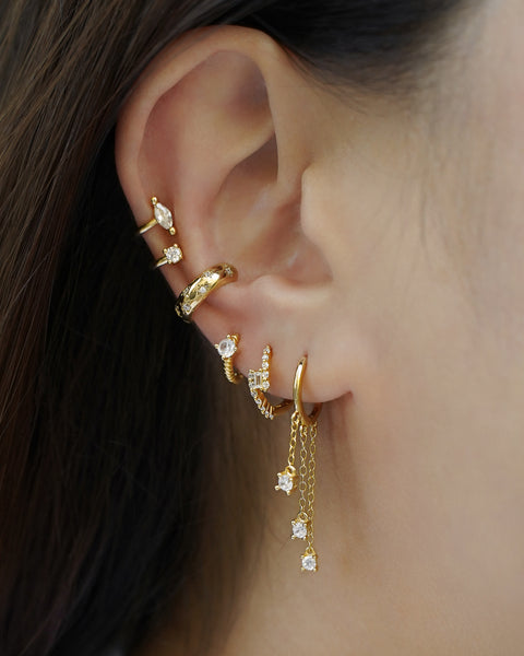 stunning ear party inspiration featuring the hexad's bestselling ear cuffs and huggie hoop earrings wiht dangle charms