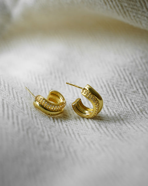 the hexad wavy double hoops in gold serve up a bold look that complements any outfit from formal business meetings to romantic date nights