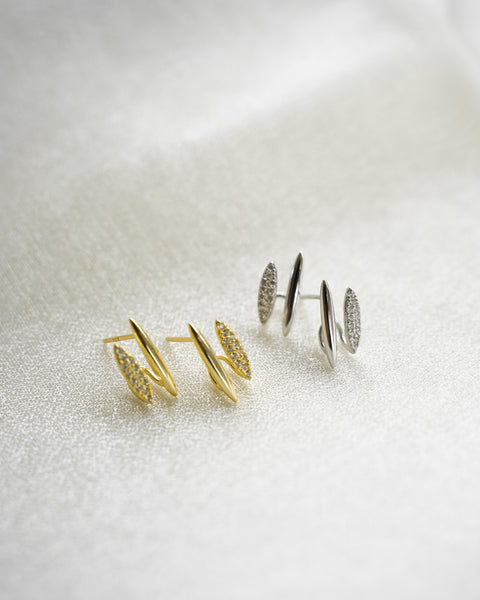 the newest revelry illusion earrings in gold and silver from the hexad are an everyday ear party style staple