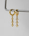 the nova dangle huggie earrings in gold are crafted for the constellation lovers