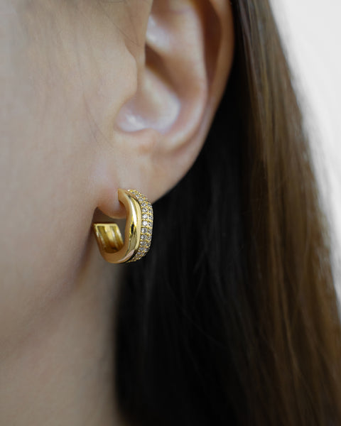 twin illusion hoops featuring bright circle zirconia stones provide understated glamour to your everyday looks