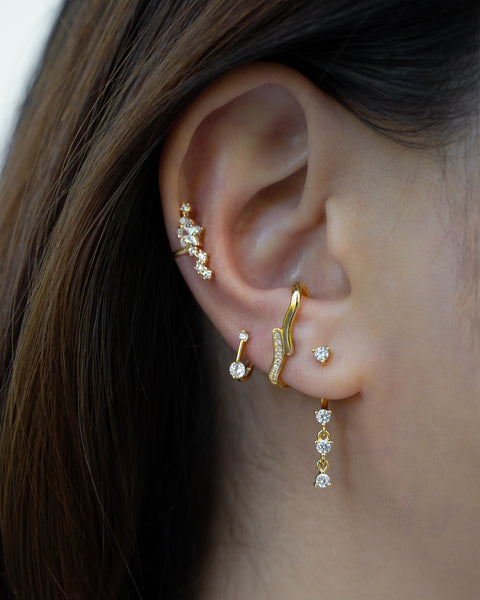 upgrade your next ear stack by layering contemporary echo suspender earrings, stunning constellation ear cuff and timless drop style earrings