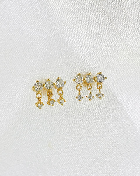 with its triple diamond dangle charms the drizzle drop earrings in 18K gold is designed to give feminine and romantic vibes