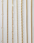 Assorted chain necklaces in gold from The Hexad's collection