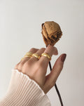 Chunky gold rings worn together for a stacked effect - Affirmation Ring by THEHEXAD