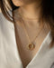Chunky golden ring pendant worn with the basic thin chain - The Hexad