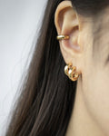 Classic golden hoop stack curated by The Hexad