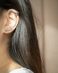 Cocoon ear cuffs and Crescendo climber earrings by The Hexad Jewellery