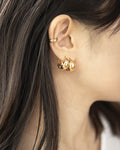 Contemporary style teardrop shape earrings in luxe gold