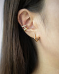 Curated ear stack with minimalist ear cuffs and pentagon hoops by The Hexad
