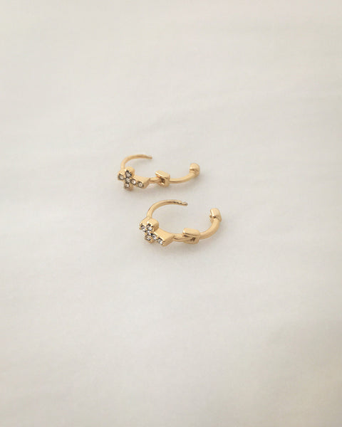 Dainty huggie hoops featuring a tiny gold cross - The Hexad Jewelry