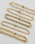 Delicate chain bracelets that are perfect for stacking - The Hexad
