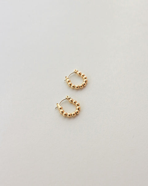 Emi beaded ball hoop earrings in gold by The Hexad