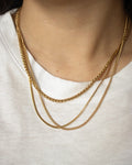 How to layer your necklaces with simple gold chains and a white tee - The Hexad