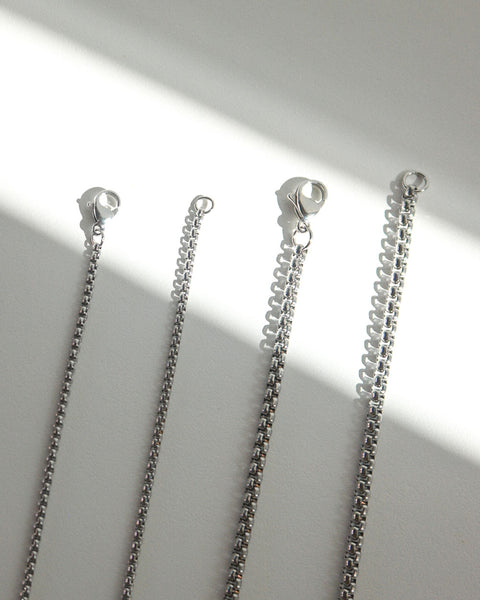 Intricate square shape chain details of The Hexad's Box Cut Chains