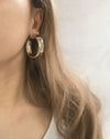 Large thick gold hoop earrings in a subtle gold color - The Hexad Earrings