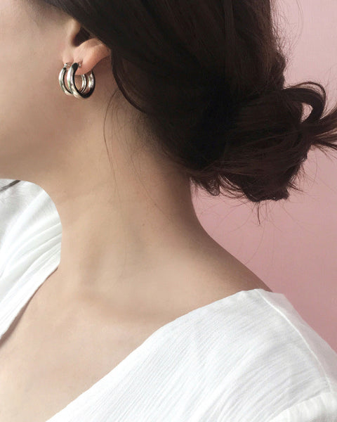 Layering the bold petite and bold medium Rei hoops in Silver - The Hexad Jewelry