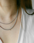 Layered box cut chains in silver from The Hexad’s Necklace Collection