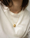 Minimalist pebble pendant necklace with thin delicate gold chain | The Hexad Jewelry