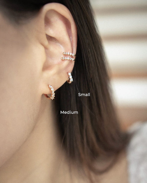 Model layers on pierceless ear cuffs without multiple piercings - The Hexad