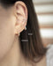 Model layers on pierceless ear cuffs without multiple piercings - The Hexad