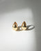 Modern hoop earrings in raindrop shape designed by The Hexad