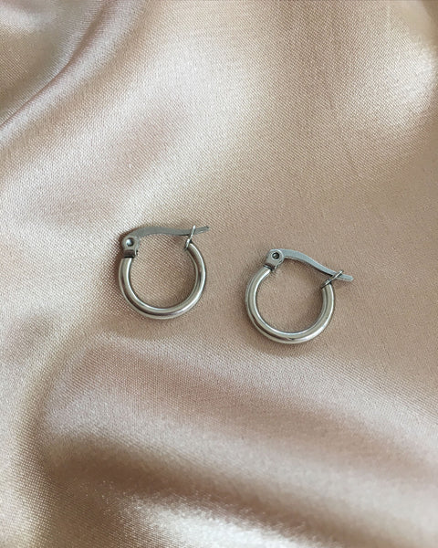 Petite silver hoops in 15mm diameter that is great for layering - The Hexad Jewelry