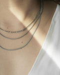 Silver chains in different textures to create the perfect neck stack - The Hexad